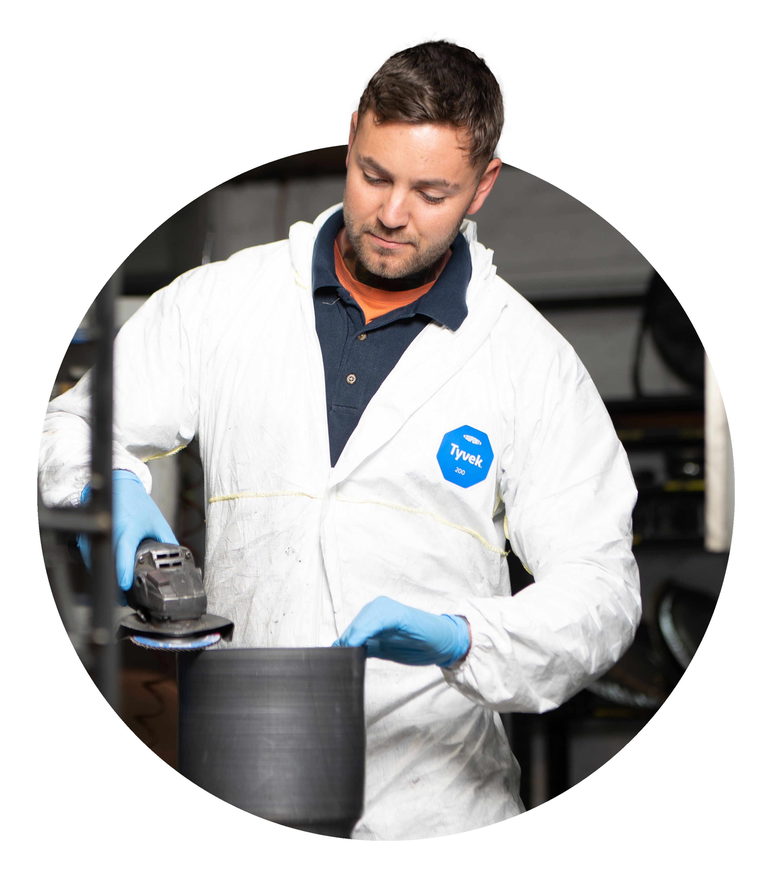 Man cutting the edge of a metal spun component